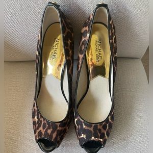 Michael Kors platform leopard print pumps, with peekaboo toe, size 10.